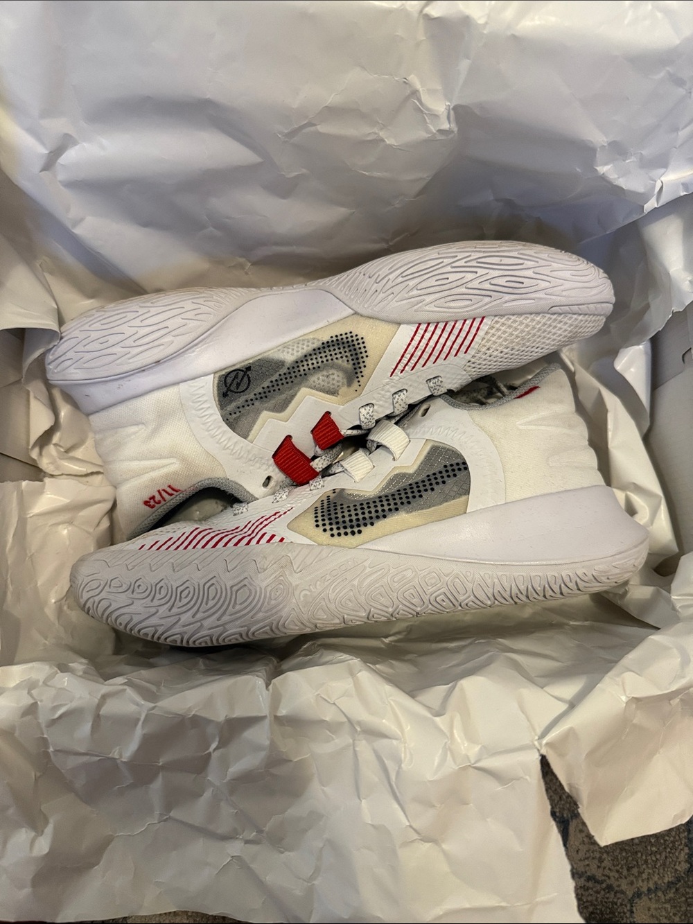 Red and White Kyrie basketball shoes